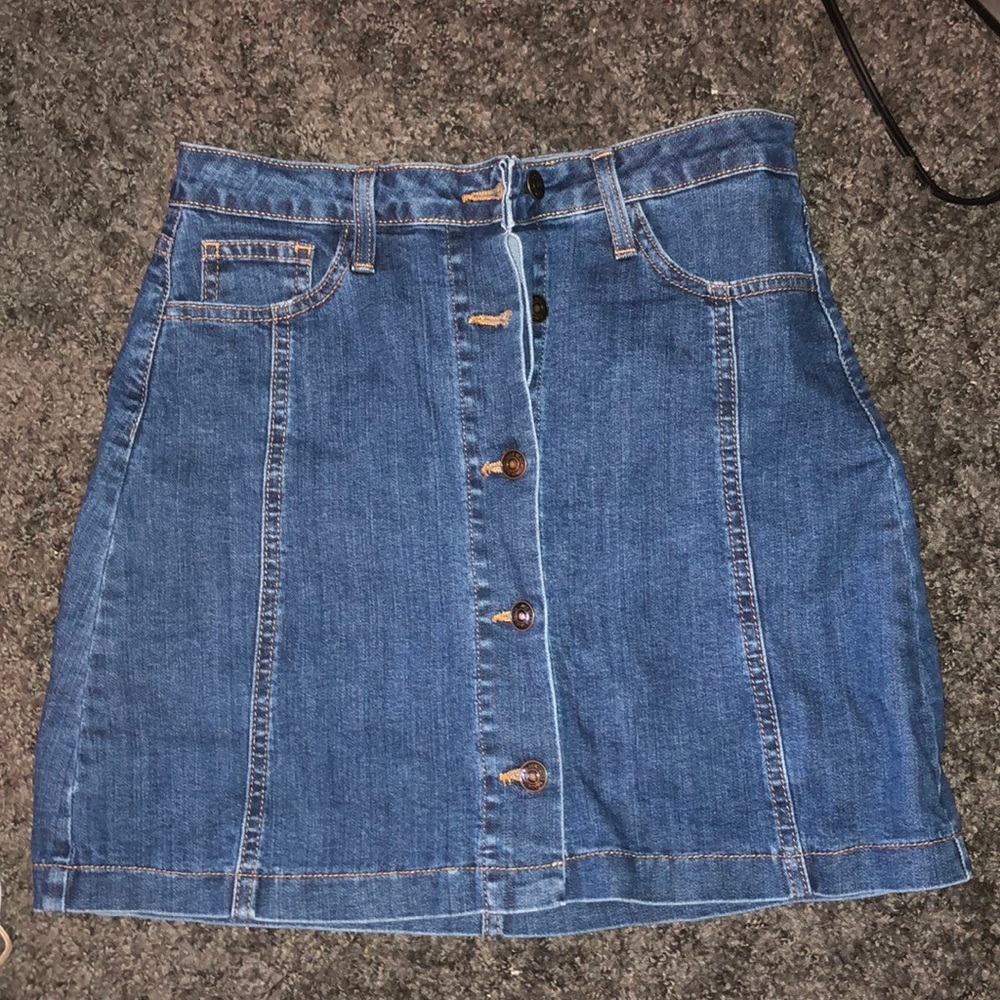 A denim button up mini skirt